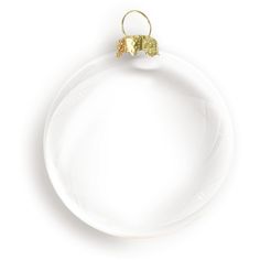 a white plate with a gold decoration on the rim and a ring hanging from it