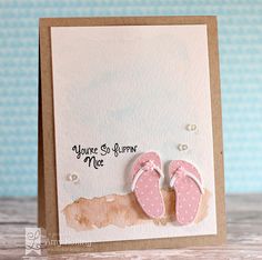 a close up of a card with a pair of pink slippers on the front