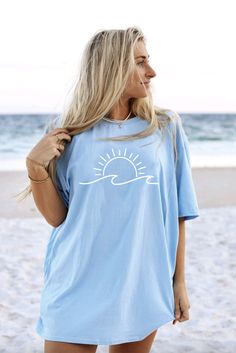 Details Beach Waves Light Blue Summer Tee Fabric has stretch It offers superior comfort and a great fit. Short sleeve style with a crew neckline, complemented by comfortable and breathable 100% cotton fabric. Enjoy an airy and lightweight feel all day. Pair this tee with jean shorts or wear a bathing suit cover up Model is wearing a large tee, please size up 2 sizes for an oversized looked Material and Care 100% Cotton Materials may have natural variations Colors may vary from different viewing Funny Whale, Press Wall, Hibiscus Shirt, Ocean Shirt, Coastal Granddaughter, Cruise Shirt, Oversized Look, Bathing Suit Covers, Brand Shirts