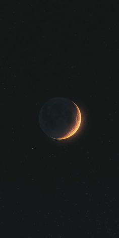 the moon is seen in the dark night sky with stars on its side and an orange crescent