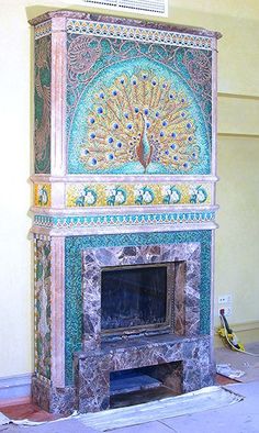 an ornate fireplace in the middle of a room with tile work on it's sides