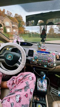 the interior of a car is decorated with hello kitty decorations