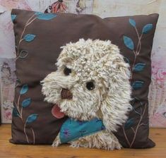 a stuffed dog is sitting on a pillow