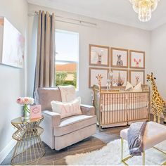 a baby's room with giraffes and other decor