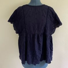 This Lightweight And Comfortable Shirt Has Lovely Embroidery On The Sleeves! Never Worn. 100% Cotton. Listed As Small/Medium. Relaxed Fit Blouse With Floral Embroidery And Short Sleeves, Cotton V-neck Blouse With Embroidered Hem, Spring Short Sleeve Blouse With Tonal Embroidery, Relaxed Fit Tops With Embroidered Hem And Short Sleeves, Relaxed Fit Short Sleeve Tops With Embroidered Hem, Relaxed Fit Tops With Embroidered Hem, Embroidered Cotton V-neck Shirt, Bohemian Blouse With Broderie Anglaise Short Sleeves, Casual Broderie Anglaise Shirt For Daywear