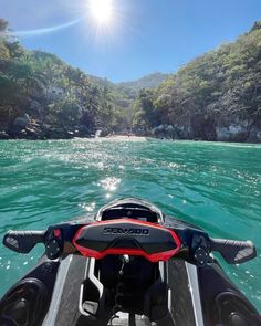 the back end of a motor boat in clear water