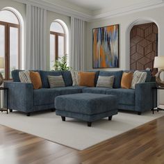 a living room with a blue couch and ottoman