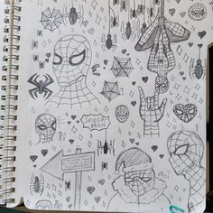 a notebook with spiderman drawings on it