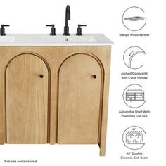 the sink cabinet is made from wood and has two faucets on each side