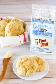 some biscuits are on a plate next to a bag of gluten free baking flour