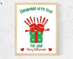 handmade with love for you merry christmas card on a white wall next to a wooden frame