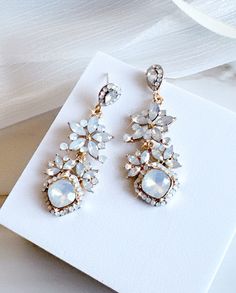 "Vintage opal Earrings Wedding Bridal Earrings Floral Crystal Rhinestone Opal Earrings Chandelier Statement earrings, Jewelry Gift for Her Add a touch of vintage glam to your look with these stunning opal earrings. Perfect for weddings, bridal events, or just a night out on the town. Floral Crystal Rhinestones: The intricate floral design of these earrings is embellished with sparkling crystal rhinestones that catch the light beautifully. Opal Stones: The opal stones add an elegant touch to the Glamorous White Bridal Earrings With Elegant Design, Crystal Jeweled Bridal Earrings For Wedding, Wedding Crystal Jeweled Chandelier Earrings, Crystal Jeweled Chandelier Earrings For Wedding, White Sparkling Crystal Bridal Earrings, Sparkling White Crystal Bridal Earrings, White Bridal Earrings For Celebration With Elegant Design, Jeweled Crystal Earrings For Weddings, White Crystal Bridal Earrings With Sparkling Stones