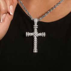 Introducing the Diamond Rope Cross Pendant in 14k White Gold, a GLD exclusive! Featuring hand-set stones in a twisted rope design, this piece is fully iced out and carefully crafted. Wear this pendant with our Rope Necklace in 4mm to upgrade your look and make a statement! This product is guaranteed for life - GLD will repair the item should you experience any defects in craftsmanship or breakage. Specifications - 38mm x 50mm (Width x Height) - Bail: Fits up to 8.5mm Chains - Weight: (Weight can