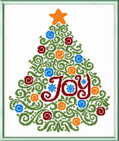 a cross stitch christmas tree with the word joy on it