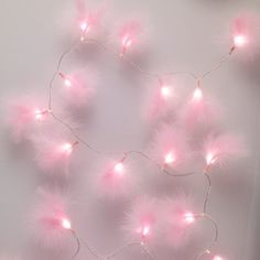 a pink wall with some lights on it