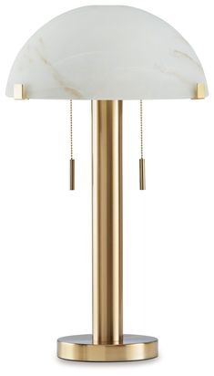 a brass table lamp with a white marble shade on the top and gold metal base