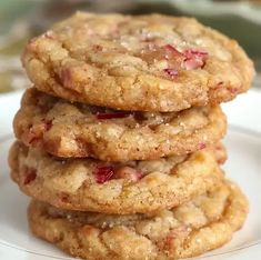 a stack of cookies sitting on top of a white plate