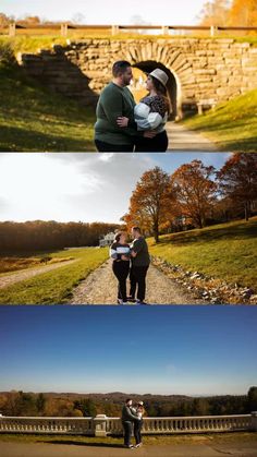 two people standing in front of a stone bridge and one person holding a baby while the other