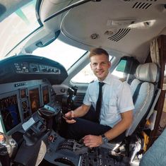 a man sitting in the cockpit of an airplane