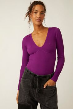 Slip into the Meg Smls V-Neck Long-Sleeve Bodysuit in Grape Juice by Free People for a flattering and versatile look. This seamless bodysuit is made from soft and stretchy fabric that hugs your curves in all the right places. The deep V-neckline and long sleeves add a touch of sexy sophistication to any outfit. <... Chic Seamless V-neck Bodysuit, Seamless Long Sleeve Bodysuit, Long Sleeve Seamless Elastane Bodysuit, Seamless Long Sleeve Elastane Bodysuit, Chic Long Sleeve Seamless Bodysuit, Chic Seamless Long Sleeve Bodysuit, Trendy V-neck Bodysuit For Loungewear, Spring V-neck Elastane Bodysuit, Second-skin V-neck Elastane Bodysuit