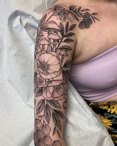 a woman with a flower tattoo on her arm