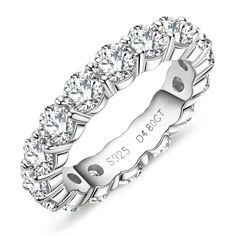 a white gold wedding band with six round cut diamonds on the side and an inscription that reads