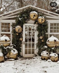 a white house covered in snow with christmas decorations