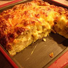 a close up of a casserole in a pan with one slice cut out