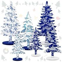 three blue and white christmas trees with snowflakes on them