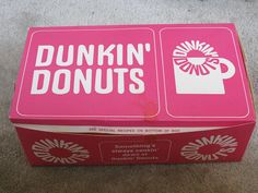 a dunkin donuts box sitting on the floor