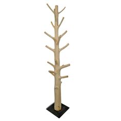 a tall wooden tree on a black base