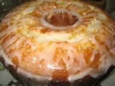 a bundt cake sitting on top of a pan covered in icing and glaze