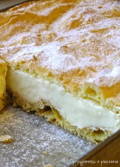 a close up of a cake in a pan with one slice missing from the pie