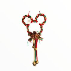 a pair of scissors decorated with ribbons and bows on a white background for valentine's day