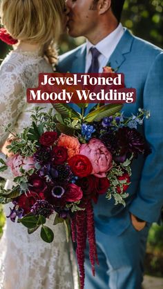 a man and woman kissing each other with the words jewel - toned moody wedding