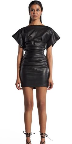 This figure-hugging mini dress is crafted entirely from luxurious lambskin leather for a toughness within the collection. The body con dress is fitted and ruched from under the bust, hugging the wearer to the mid-thigh. Complete with a wide boat neckline and cap sleeve detail. Thoughtful panelling crafts an opening across the mid back for edge, closed at the side with an exposed zip. Body Con Dress, Boat Neckline, Leather Dress, Sleeve Detail, Lambskin Leather, Date Night Outfit, Cap Sleeve, Cocktail Party, The Collection