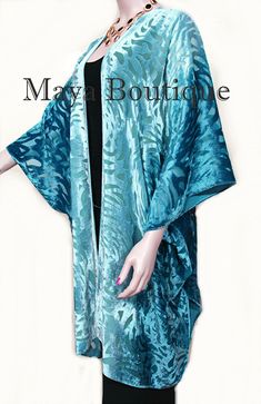 "DESCRIPTION Maya Matazaro Teal Ombre Camellia Burnout Velvet Caftan Kimono Jacket Hand Dyed & Made in USA Elegant kimono in the caftan style Teal ombre Color A true wearable art! Burnout velvet Camellia design Rayon Blend Free size - Good for Regular sizes & Plus Sizes too 76\" Wingspan Open front 36\" Long Please note that each caftan is individually hand dyed by Maya personally, so colors will vary slightly from caftan to caftan As with all hand dyed fabrics each one is unique, but yo Art Burnout, Velvet Caftan, Elegant Kimono, Teal Ombre, Burnout Velvet, Hand Dyed Fabric, Ombre Color, Kimono Jacket, Blue Ombre