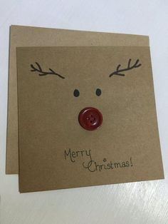 a christmas card with reindeer's nose and antlers on it