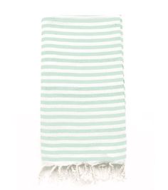 a green and white striped towel with fringes