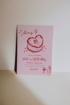 a pink card with a heart shaped cake on it