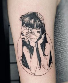 a woman's arm with a black and white drawing of her face on it