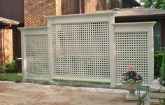 a white fence in front of a house