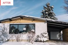 a house with snow on the ground and trees