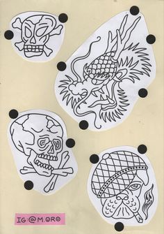 four stickers with designs on them that include skulls and dragon heads, one is black and the other white