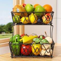 two metal baskets filled with assorted fruits and vegetables