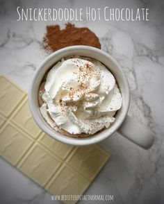 a cup of hot chocolate with whipped cream on top