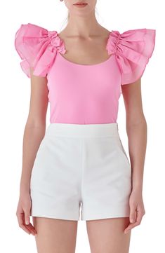 Luscious organza ruffles frame this fitted knit top that sweetens your day-to-night vibe. Scoop neck Short sleeves 95% rayon, 5% spandex with 100% polyester contrast Hand wash, dry Imported Summer Nylon Tops, Pink Fitted Nylon Tops, Pink Nylon Summer Top, Pink Nylon Top For Summer, Feminine Ruffled Stretch Top, Fitted Nylon Pink Tops, Fitted Ruffle Hem Top For Party, Feminine Stretch Top With Ruffles, Feminine Stretch Tops With Ruffles