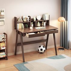 a child's desk and bookcase in a room with hardwood floors, rugs and curtains