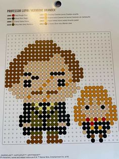 a cross - stitch pattern with two people on it, one is wearing sunglasses and the other has an orange hair