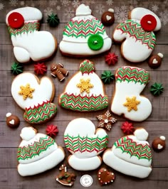 decorated christmas cookies are arranged on a table